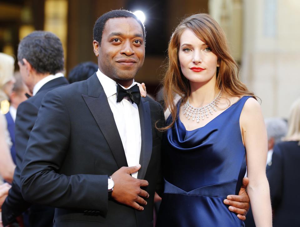 Chiwetel Ejiofor, best actor nominee for his role in "12 years a Slave", and his girlfriend Sari Mercer arrive at the 86th Academy Awards in Hollywood
