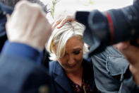 <p>Marine Le Pen, French National Front (FN) party candidate for 2017 presidential election, is protected by bodyguards as eggs are thrown by demonstrators during her arrival in Dol-de-Bretagne, France, May 4, 2017. (Stephane Mahe/Reuters) </p>