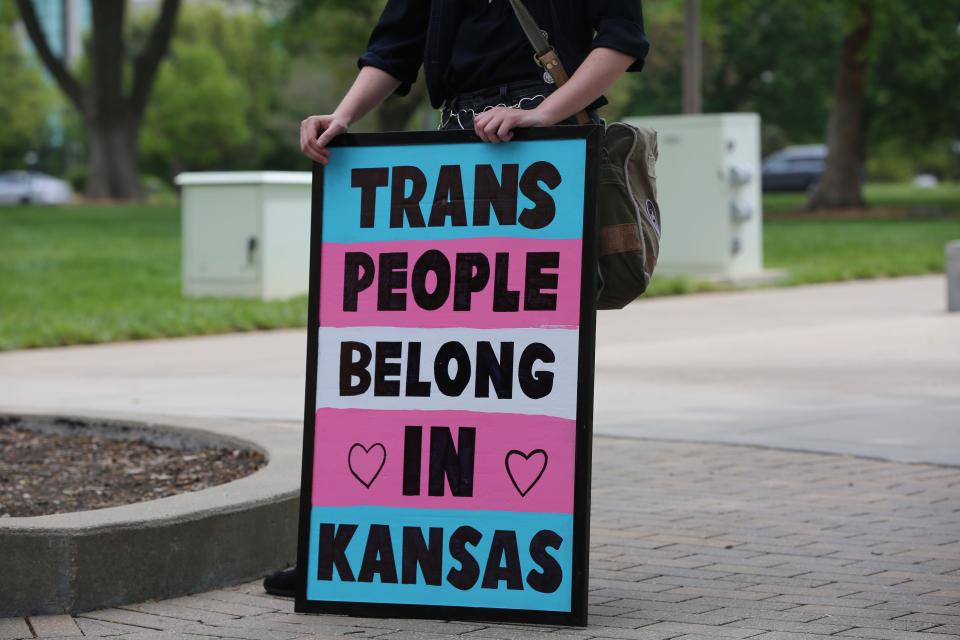 A group of transgender individuals who forced the state to allow Kansans to change the gender markers on their birth certificates is opposing an effort by Attorney General Kris Kobach to undo that policy.