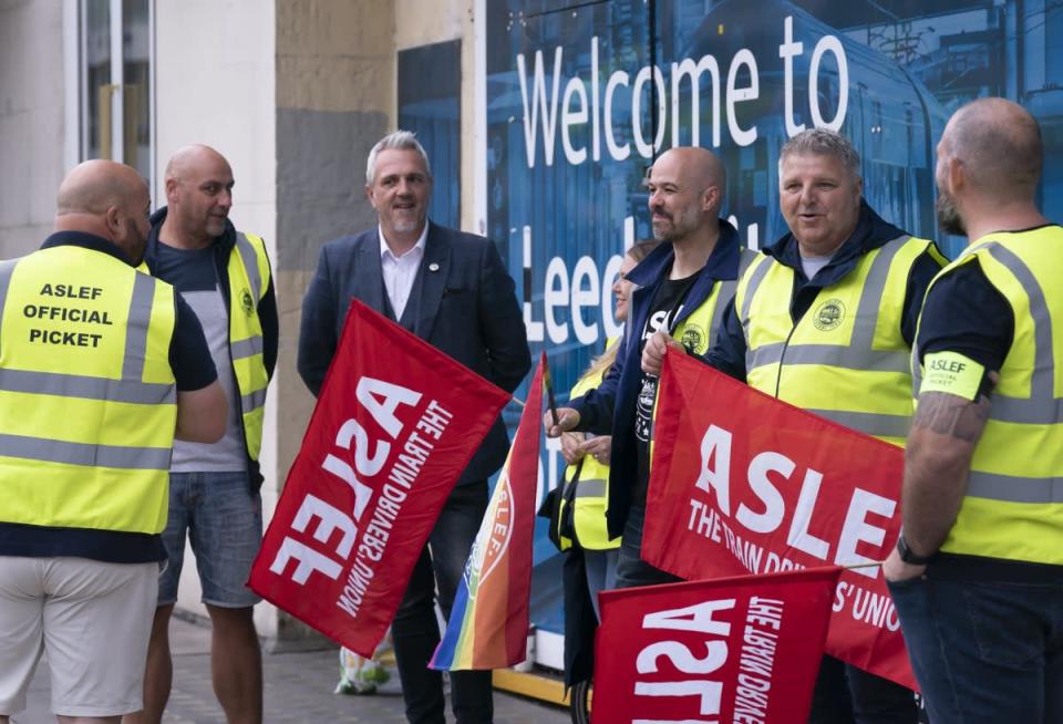 Protesters on the picket line outside Leeds railway station (Danny Lawson/PA) (PA Wire)