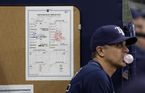 Tampa Bay Rays major league field coordinator Paul Hoover stands near the line up card during the bottom of the eighth inning of a baseball game against the Boston Red Sox Wednesday, July 24, 2019, in St. Petersburg, Fla. (AP Photo/Chris O'Meara)