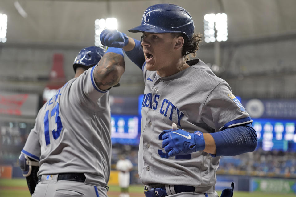 Kansas City Royals' Nick Pratto (32) celebrates with Salvador Perez (13) after Pratto hit a solo home run off Tampa Bay Rays starting pitcher Zach Eflin during the first inning of a baseball game Friday, June 23, 2023, in St. Petersburg, Fla. (AP Photo/Chris O'Meara)