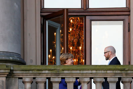 Leader of the Christian Democratic Union of Germany (CDU) Angela Merkel and Secretary General of the Christian Democratic Union (CDU) Peter Tauber are seen on a balcony of German Parliamentary Society offices during the exploratory talks about forming a new coalition government held by CDU/CSU in Berlin, Germany, October 30, 2017. REUTERS/Axel Schmidt