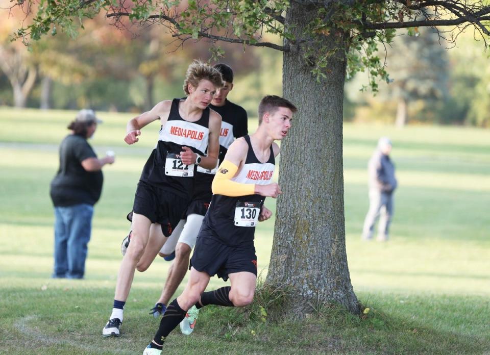 Mediapolis runners, right to left, Solomon Zaugg, Owen Schmidgall and Jeff Campbell finished first, second and third, respectively, in the Mediapolis Invitational Thursday at Heritage Oaks Golf Course in Wapello.