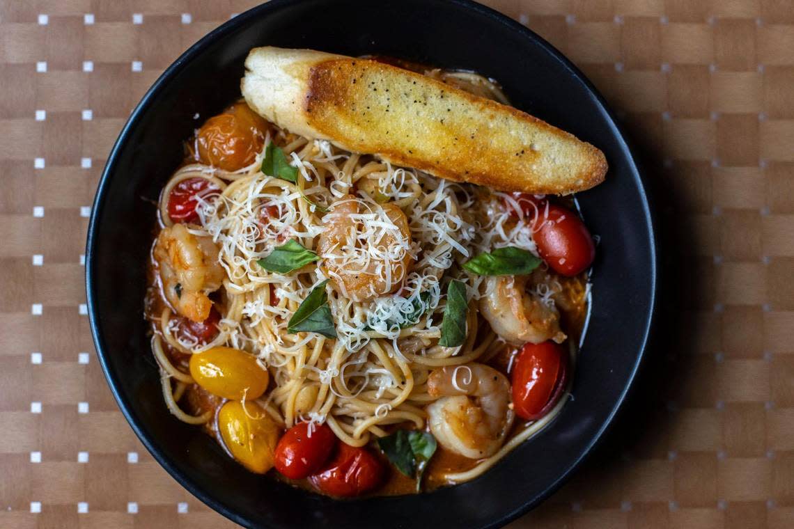 The pomodoro with shrimp at Romero’s is made with fresh noodles tossed in garlic, basil and olive oil with roasted cherry tomatoes. Romero’s uses locally sourced, primarily organic ingredients and does not have a microwave in its kitchen. Ryan C. Hermens/rhermens@herald-leader.com