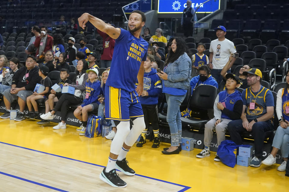 Golden State Warriors guard Stephen Curry warms up before an NBA preseason basketball game against the San Antonio Spurs in San Francisco, Friday, Oct. 20, 2023. (AP Photo/Jeff Chiu)