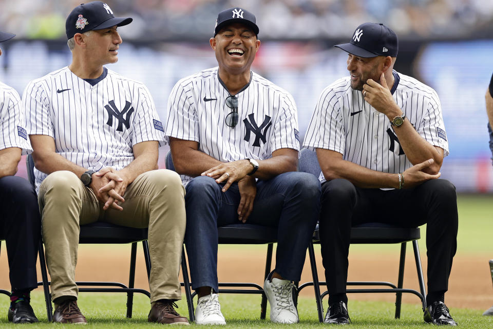 Former New York Yankees' Andy Pettitte, left, Mariano Rivera and Derek Jeter, right, are seen during Yankees Old-Timers' Day ceremony before a baseball game against the Milwaukee Brewers on Saturday, Sept. 9, 2023, in New York. (AP Photo/Adam Hunger)