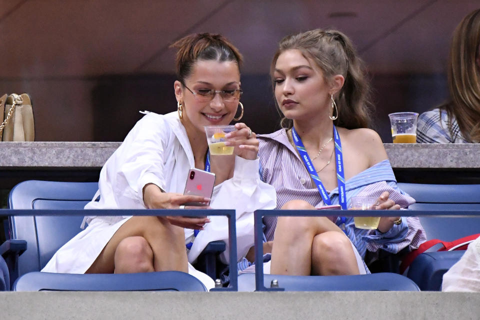 Sep 4, 2018; New York, NY, USA; Models Bella Hadid, left, and Gigi Hadid take a selfie before Serena Williams of the United States faces Karolina Pliskova of Czech Republic in a quarter-final match on day nine of the 2018 U.S. Open tennis tournament at USTA Billie Jean King National Tennis Center. Mandatory Credit: Danielle Parhizkaran-USA TODAY Sports