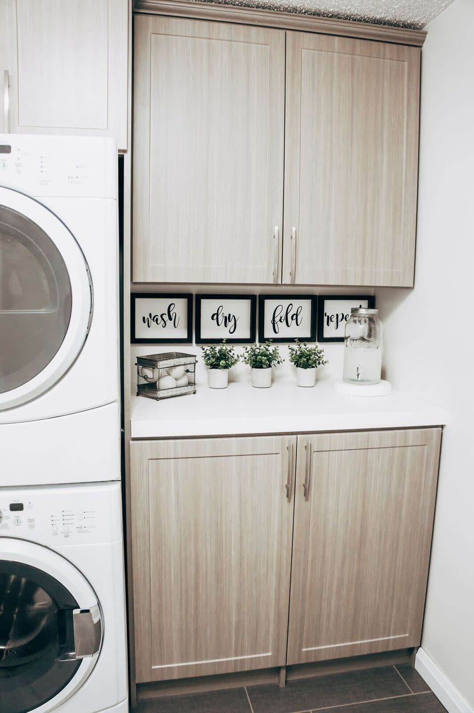 <p>You’ll be pleased to know that you can make these absolutely adorable farmhouse signs for your laundry room with artist panels scored at the dollar store. </p><p><strong>Get the tutorial at <a href="https://www.robynjohanna.com/diy-dollar-store-farmhouse-sign/" rel="nofollow noopener" target="_blank" data-ylk="slk:Robyn Johanna;elm:context_link;itc:0;sec:content-canvas" class="link ">Robyn Johanna</a>.</strong></p><p><a class="link " href="https://www.amazon.com/gp/product/B017NNJQWE/?tag=syn-yahoo-20&ascsubtag=%5Bartid%7C10050.g.31153820%5Bsrc%7Cyahoo-us" rel="nofollow noopener" target="_blank" data-ylk="slk:SHOP WOOD STAIN;elm:context_link;itc:0;sec:content-canvas">SHOP WOOD STAIN</a></p>