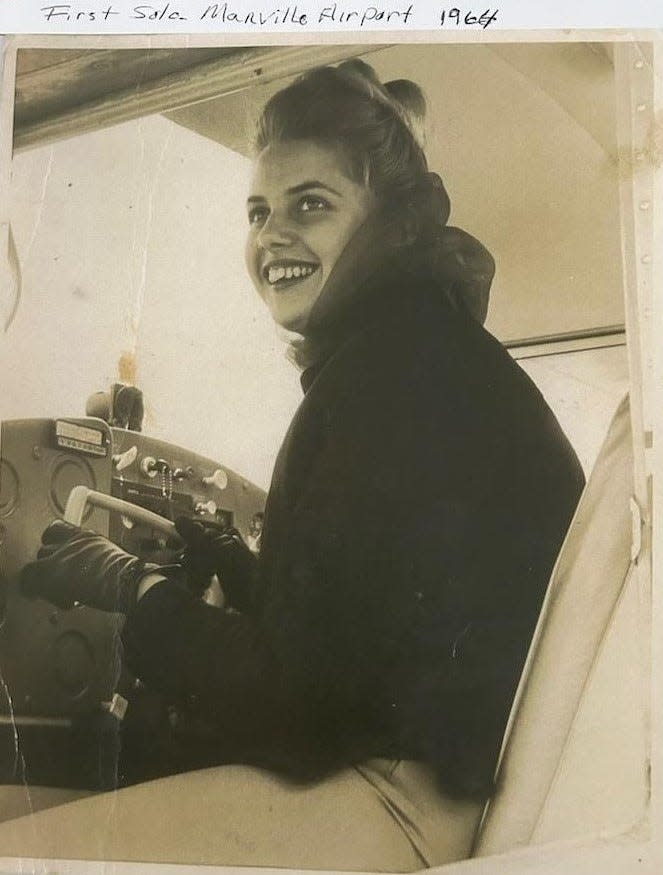 A 20-year-old Michelle Freestone, who was Michelle Decker at the time, prepares for her first solo flight in 1964.