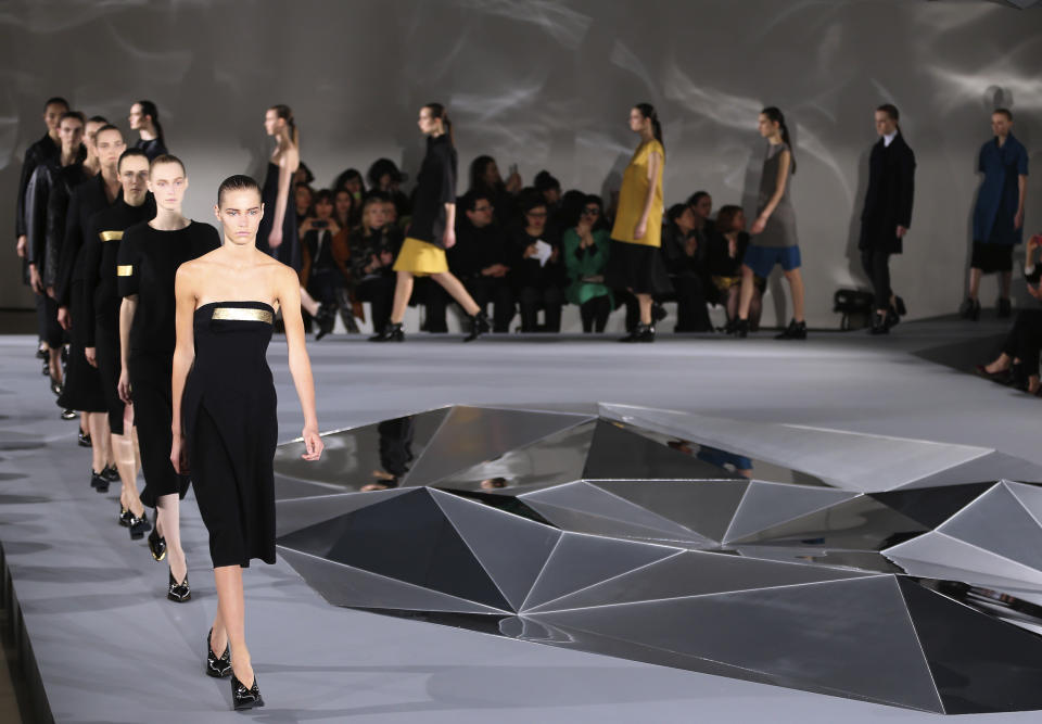 Models wear creations for Jil Sander women's Fall-Winter 2013-14 collection, part of the Milan Fashion Week, unveiled in Milan, Italy, Saturday, Feb. 23, 2013. (AP Photo/Antonio Calanni)