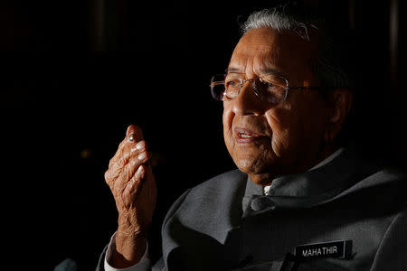 Malaysia's Prime Minister Mahathir Mohamad speaks during an interview with Reuters in Putrajaya, Malaysia June 19, 2018. REUTERS/Lai Seng Sin