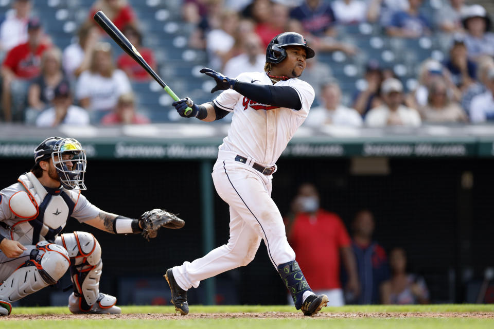 Cleveland Guardians' Jose Ramirez watches his RBI single off Detroit Tigers starting pitcher Drew Hutchison during the fifth inning in the first baseball game of a doubleheader Monday, Aug. 15, 2022, in Cleveland. (AP Photo/Ron Schwane)