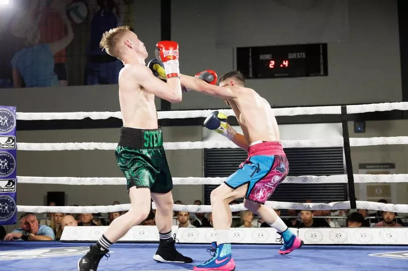 Andy Tham fighting George Stewart in their Celtic Featherweight title fight in May 2024.