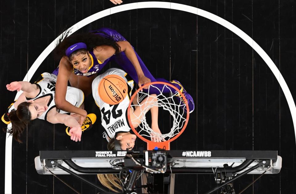 PHOTO: In this April 2, 2023, file photo, Angel Reese of the LSU Lady Tigers and Caitlin Clark and Gabbie Marshall of the Iowa Hawkeyes are shown during the 2023 NCAA Women's Basketball Tournament National Championship, in Dallas, Texas.  (Ben Solomon/NCAA Photos via Getty Images, FILE)