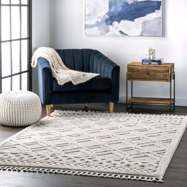 A minimalist's dream, this rug with a neutral color pallet will add some depth and dimension to your space without overpowering all your other decor. <br /><br /><strong>Promising review:</strong> "I absolutely love this rug! <strong>It adds texture to a room and is super soft.</strong> As other reviews have said it does have more gray in person than in the photos but it's very beautiful and great quality." &mdash;Hannah<br /><br /><strong>Get it from Rugs USA for <a href="https://go.skimresources.com?id=38395X987171&amp;xs=1&amp;xcust=HPHomeMagazine-609acebfe4b099ba752f64c2-&amp;url=https%3A%2F%2Fwww.rugsusa.com%2Frugsusa%2Frugs%2Frugs-usa-shaggy-lattice-tassel%2FBeige%2F200KKLR12A-P.html" target="_blank" rel="nofollow noopener noreferrer" data-skimlinks-tracking="5854435" data-vars-affiliate="rugs-usa.ozkewk.net" data-vars-campaign="SHOPMagazineHomeMower2-2-2021--5854435-" data-vars-href="https://rugs-usa.ozkewk.net/c/468058/555367/9280?subId1=SHOPMagazineHomeMower2-2-2021--5854435-&amp;u=https%3A%2F%2Fwww.rugsusa.com%2Frugsusa%2Frugs%2Frugs-usa-shaggy-lattice-tassel%2FBeige%2F200KKLR12A-P.html" data-vars-link-id="16331356" data-vars-price="" data-vars-product-id="20945810" data-vars-product-img="https://www.rugsusa.com/ajaxzoom/axZm/zoomLoad.php?azImg=/pic/products/200KKLR12B_run.jpg&amp;qual=80&amp;width=1200&amp;height=1200" data-vars-product-title="Beige Shaggy Lattice Tassel Area Rug" data-vars-redirecturl="https://www.rugsusa.com/rugsusa/rugs/rugs-usa-shaggy-lattice-tassel/Beige/200KKLR12A-P.html" data-vars-retailers="rugsusa" data-ml-dynamic="true" data-ml-dynamic-type="sl" data-orig-url="https://rugs-usa.ozkewk.net/c/468058/555367/9280?subId1=SHOPMagazineHomeMower2-2-2021--5854435-&amp;u=https%3A%2F%2Fwww.rugsusa.com%2Frugsusa%2Frugs%2Frugs-usa-shaggy-lattice-tassel%2FBeige%2F200KKLR12A-P.html" data-ml-id="18">$63.90+</a> (available in two colors, two shapes and six sizes).</strong>