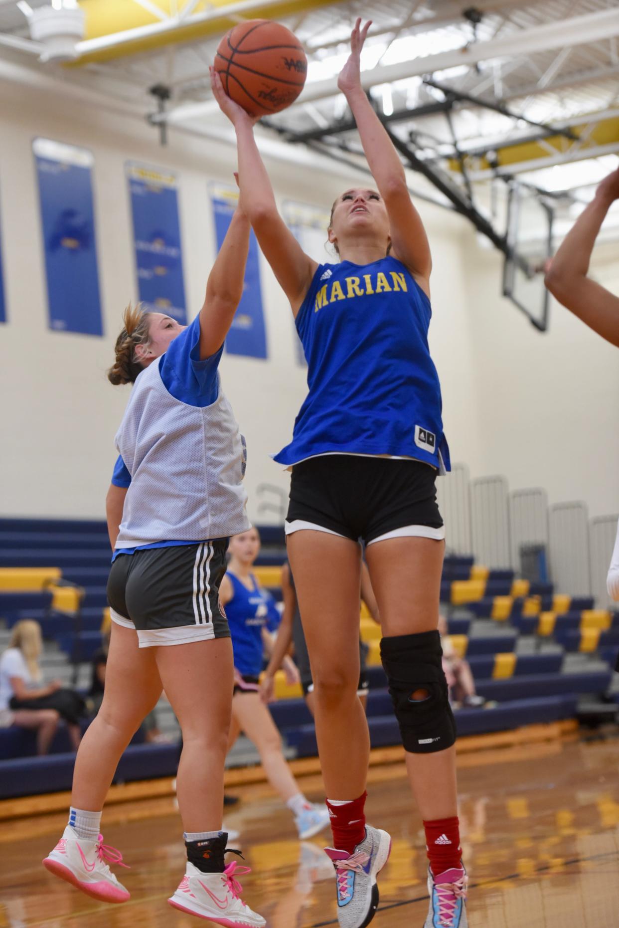 Bloomfield Hills Marian's Mckenzie Swanson scores down low during a girls basketball scrimmage Thursday, Aug. 3, 2023.