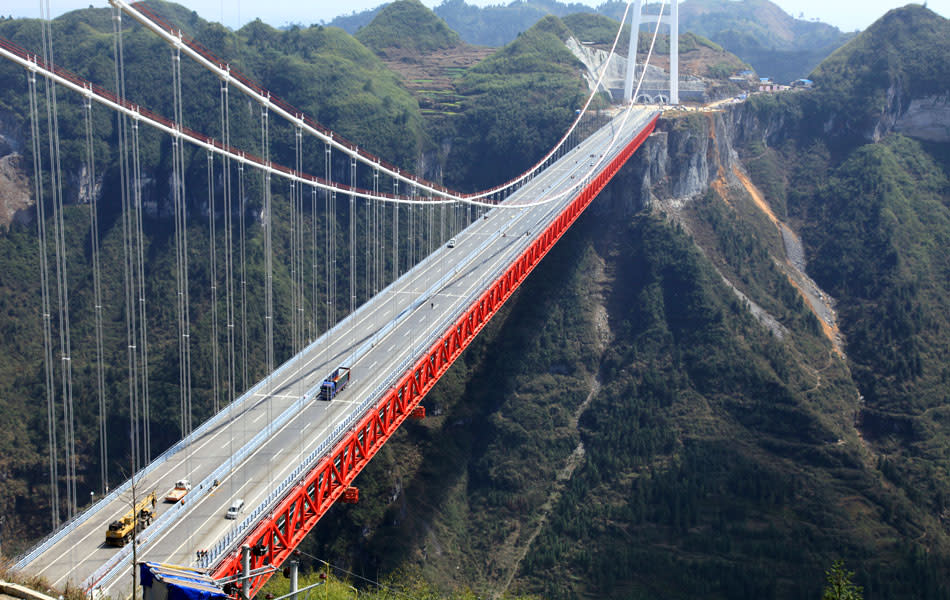 The Aizhai bridge, the world’s highest tunnel to tunnel bridge, at 336 meter-high (1,102 feet) and spanning 1,176 meters (3,858 feet), officially opens to traffic in Jishou, central China's Hunan province on March 31, 2012.AFP PHOTO