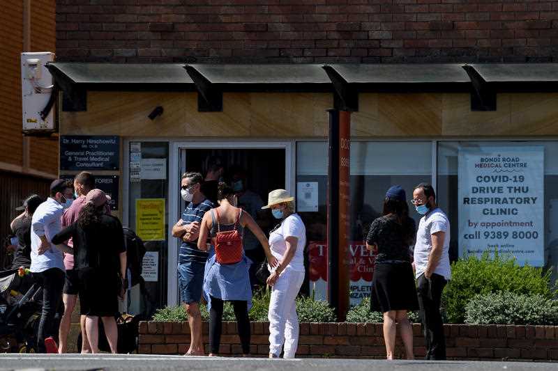 Members of the public queue for a coronavirus PCR test at a doctor’s surgery in Sydney.