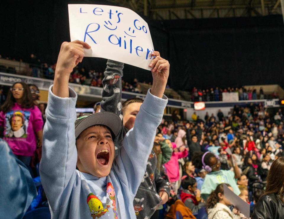 Tatnuck Magnet School third-grader Gideon Phillippi and hundreds of Worcester Public Schools students cheer for the Railers during a morning hockey game at the DCU Center Wednesday, November 29, 2023.