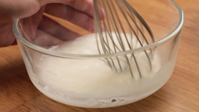 Whisking a lemon loaf cake glaze