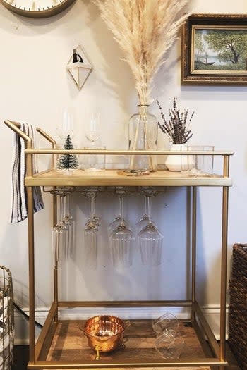 a reviewer's bar cart with the gold racks underneath