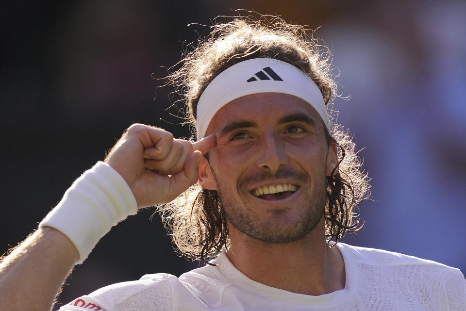 Stefanos Tsitsipas of Greece reacts after beating Britain's Andy Murray in a men's singles match on day five of the Wimbledon tennis championships in London, Friday, July 7, 2023. (AP Photo/Alberto Pezzali)
