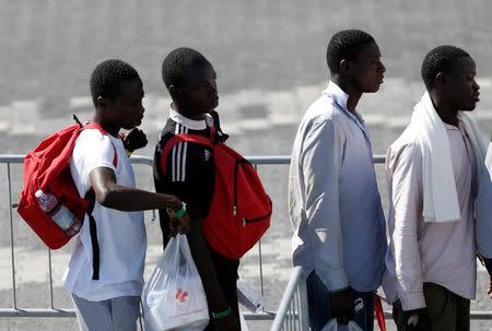 Migrants disembark at the Sicilian port of Catania, Italy, October 4, 2016. REUTERS/Antonio Parrinello