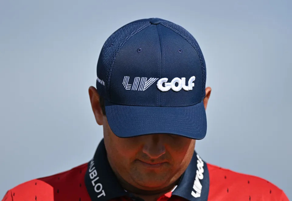 U.S. golfer Patrick Reed wears a LIV Golf branded cap and shirt during a practice round for The 150th British Open Golf Championship at St Andrews in Scotland on July 13, 2022. (Photo by Glyn KIRK / AFP)