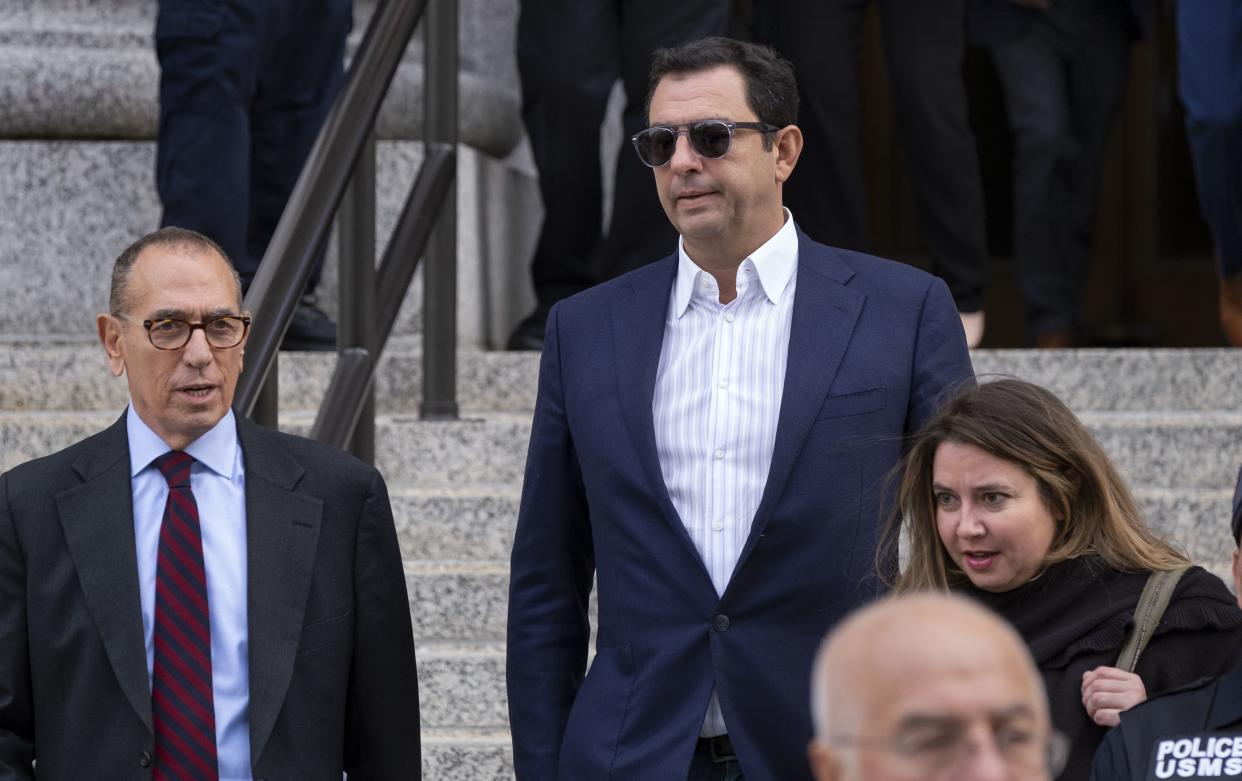 Andrey Kukushkin, center, leaves federal court in Manhattan in 2019.