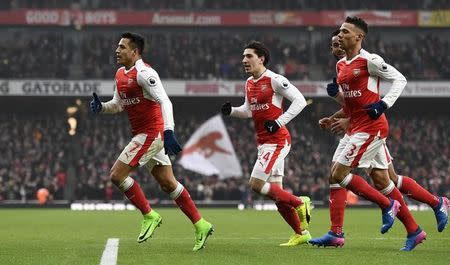 Britain Soccer Football - Arsenal v Hull City - Premier League - Emirates Stadium - 11/2/17 Arsenal's Alexis Sanchez celebrates scoring their first goal with teammates Reuters / Dylan Martinez Livepic