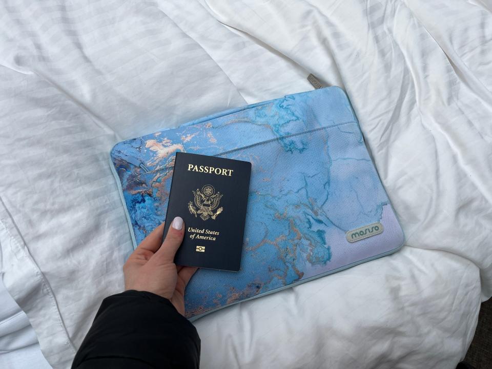 A passport and a laptop