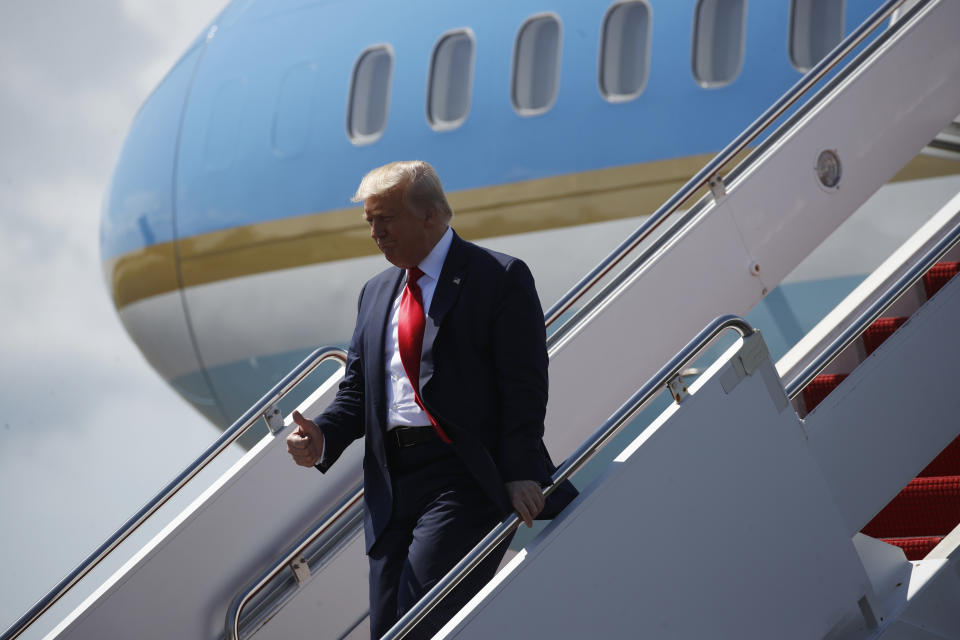 President Donald Trump steps off Air Force One at Tampa International Airport in Tampa, Fla., Friday, July 31, 2020. (AP Photo/Patrick Semansky)