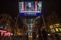 A large video screen shows a government news report about the inauguration of President Joe Biden at a shopping mall in Beijing, Thursday, Jan. 21, 2021. China has expressed hope the Biden administration will improve prospects for people of both countries and give a boost to relations after an especially rocky patch, while getting in a few final digs at former Trump officials. (AP Photo/Mark Schiefelbein)