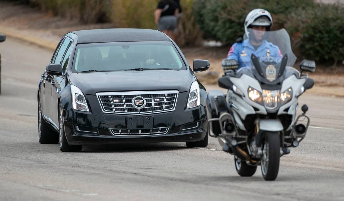 A Raleigh Police Department motorcycle officer escorts the family of Wake County Deputy Ned Byrd to his funeral at Providence Baptist Church on Friday, August 19, 2022 in Raleigh, N.C.