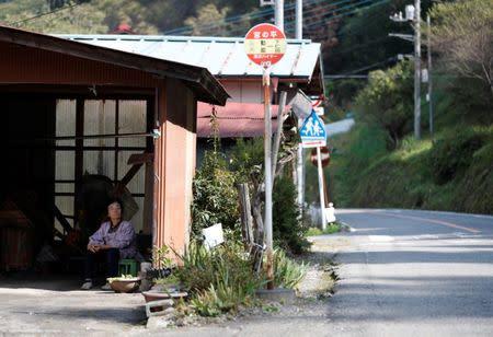 A local resident pauses in Nanmoku Village, northwest of Tokyo, Japan October 12, 2017. Picture taken October 12, 2017. REUTERS/Issei Kato