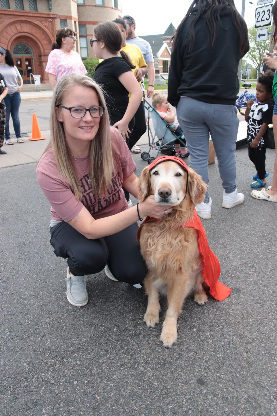 Nichole Edwards and her dog, Beau, of Adrian won the best-looking pet contest Tuesday during the 517 Party at Nova's Soda Pop Candy Shop in downtown Adrian. Beau was dressed as a superhero, complete with mask and cape.