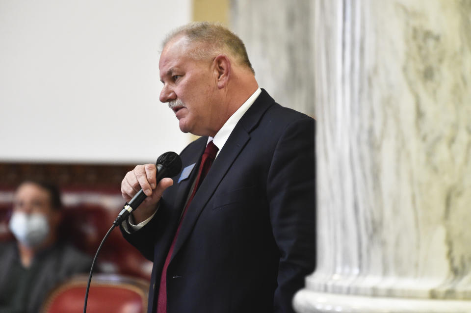 FILE - State Rep. Barry Usher, R-Billings, speaks during a meeting of the Joint Rules Committee on the House floor at the Montana State Capitol in Helena, Mont., on Dec. 7, 2020. The dozens of statehouse bills to restrict health care for transgender youths were in many cases not born of grassroots despair and a groundswell of constituent demand, but were pre-written and shopped out by a handful of conservative interest groups. One of the clearest examples is in Montana, where nearly all the language in Senate Bill 99 can be found in Do No Harm's model bill. Usher voted in favor of the bill. (Thom Bridge/Independent Record via AP, File)