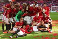 Football Soccer Britain - Leicester City v Manchester United - FA Community Shield - Wembley Stadium - 7/8/16 Manchester United celebrate with the trophy after winning the FA Community Shield Reuters / Eddie Keogh Livepic EDITORIAL USE ONLY. No use with unauthorized audio, video, data, fixture lists, club/league logos or "live" services. Online in-match use limited to 45 images, no video emulation. No use in betting, games or single club/league/player publications. Please contact your account representative for further details.