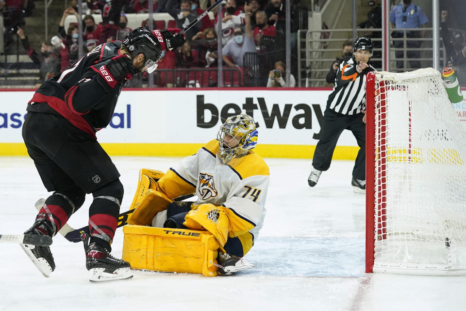 Carolina Hurricanes center Jordan Staal (11) reacts after scoring against Nashville Predators goaltender Juuse Saros (74) during overtime in Game 5 of an NHL hockey Stanley Cup first-round playoff series in Raleigh, N.C., Tuesday, May 25, 2021. (AP Photo/Gerry Broome)