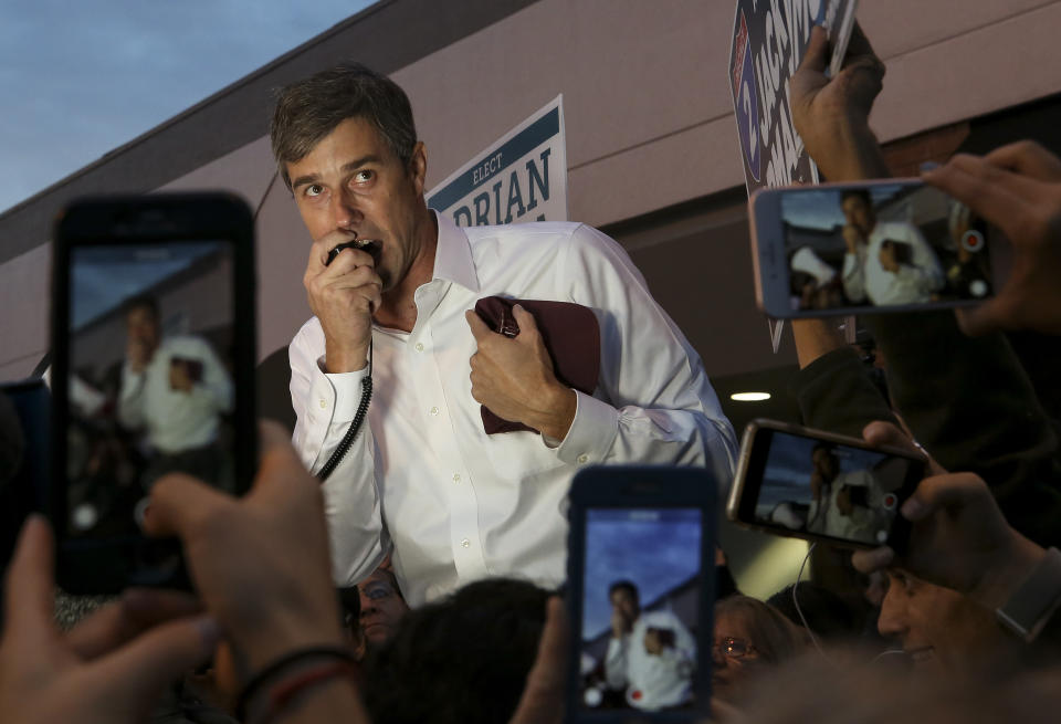 U.S. Senate candidate Beto O'Rourke talks to a group of supporters and early voters at the River Oaks Plaza parking lot Monday, Oct. 22, 2018, in Houston. (Godofredo A. Vasquez/Houston Chronicle via AP)