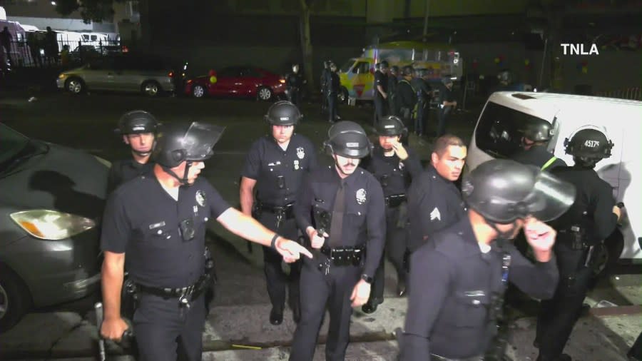 Police in riot gear respond after multiple people were stabbed at a Copa América final watch party in Los Angeles. (TNLA)