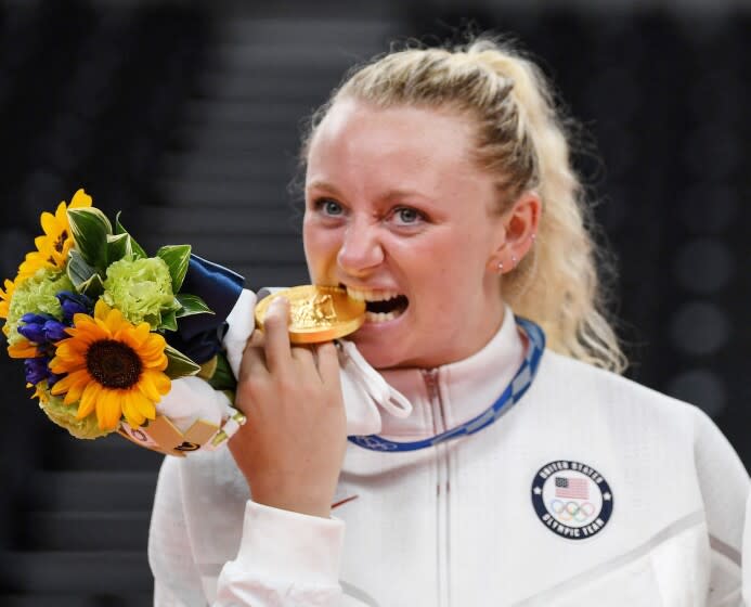 USA's Jordyn Poulter with her gold medal during the women's volleyball victory ceremony during the Tokyo 2020 Olympic Games at Ariake Arena in Tokyo on August 8, 2021. (Photo by Yuri Cortez / AFP) (Photo by YURI CORTEZ/AFP via Getty Images)