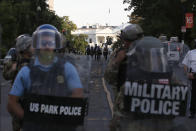 Police clear the area around Lafayette Park and the White House as demonstrators gather to protest the death of George Floyd, Monday, June 1, 2020, in Washington. Floyd died after being restrained by Minneapolis police officers. (AP Photo/Alex Brandon)