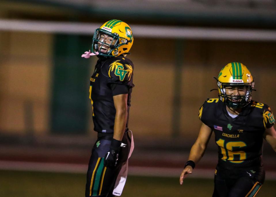 Coachella Valley's Miguel Rodriguez (1) smiles after a touchdown during the second quarter of their game at Coachella Valley High School in Thermal, Calif., Friday, Sept. 15, 2023.