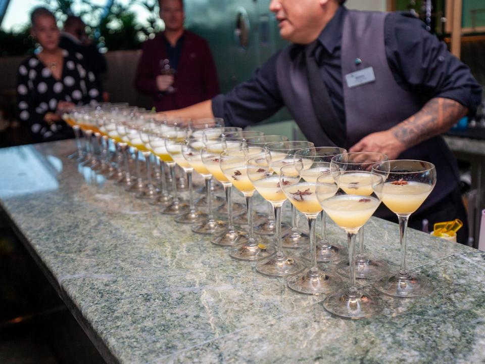 a bartender preparing drinks at Eden