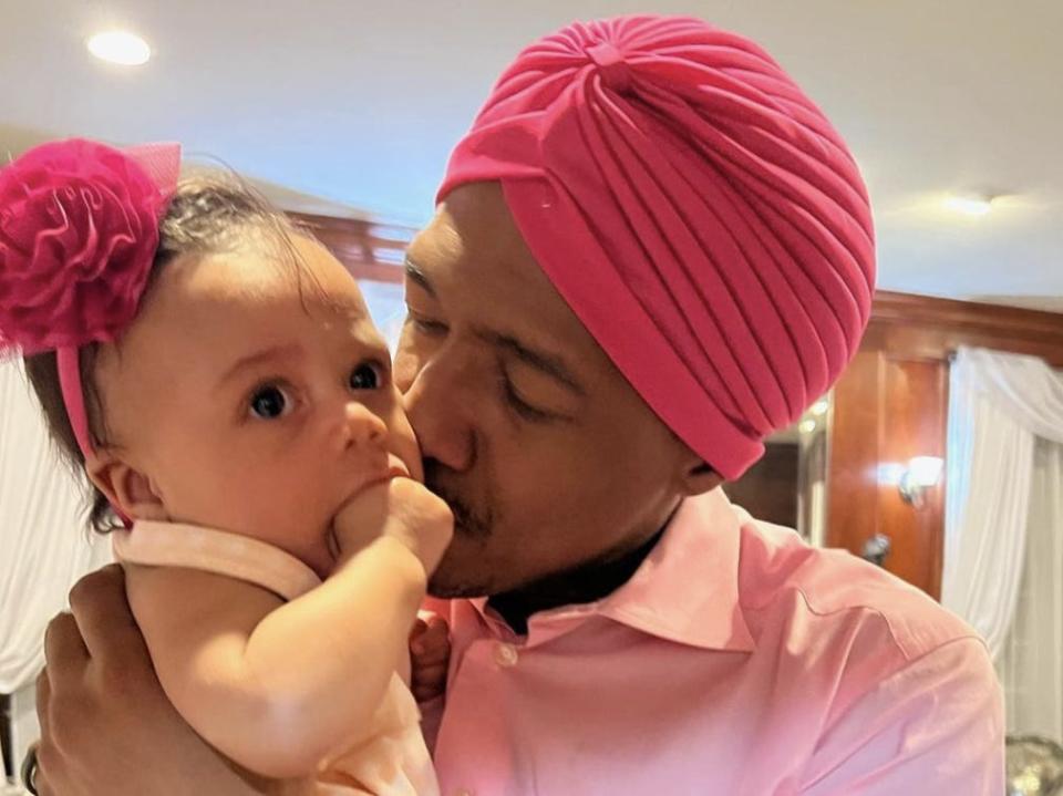 Nick Cannon poses with his daughter Halo.