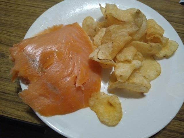 Lox and chips on a plate.