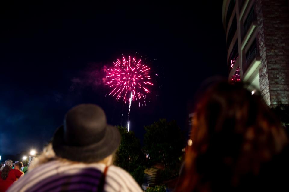 Crowds gather to watch fireworks during the lighting ceremony for the Arc of Dreams in downtown Sioux Falls, Wednesday, July 24. 
