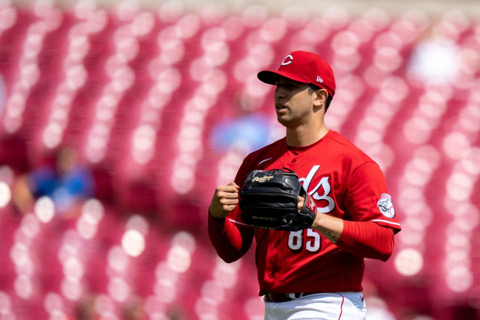 Cincinnati Reds relief pitcher Luis Cessa (85) pounds his glove after getting the final out stranding 2 Pittsburgh Pirates runners in the top of the third inning at Great American Ball Park Tuesday.